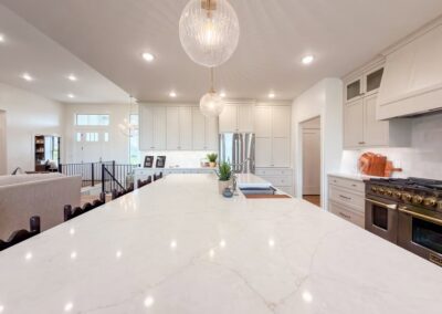 Bright open kitchen with large marble island