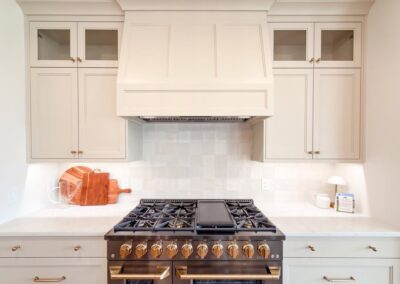 Luxury gas range with brass knobs and hood