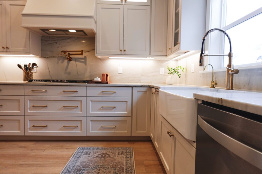 Kitchen with under-cabinet lighting on custom cabinets by Rivermill in Cache Valley, Utah