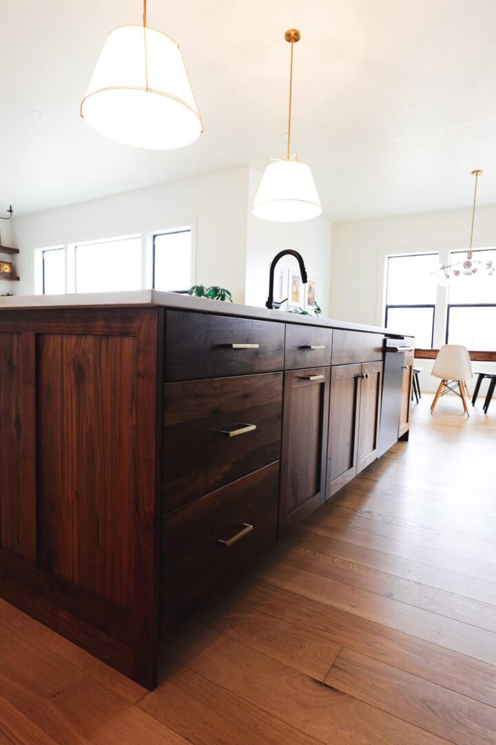 Modern Smithfield Utah kitchen with dark wood island cabinetry